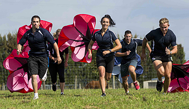 Bachelor of Sport and Recreation course thumbnail image Toi Ohomai sports students running with parachutes