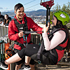 Tourism and Travel student hooking a visitor onto a zipline 