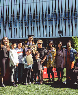 Johnny Rapana, with his whānau, at his graduation from Waikato University