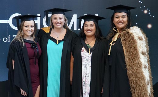 Graduates pose for photo