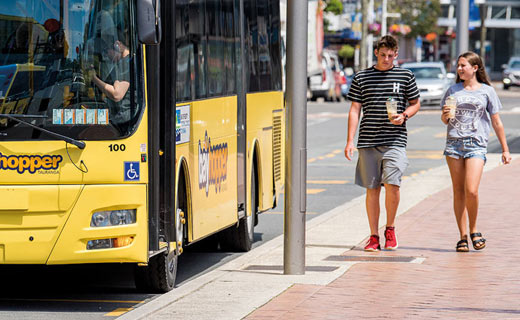 Bus pulling up to bus stop