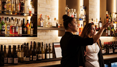 Bar Manager showing Hospitality student around