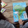 Teacher reading a book with a child 