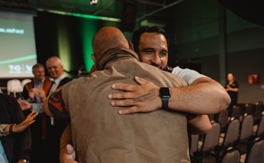 Toi Ohomai graduand embraces with whanau