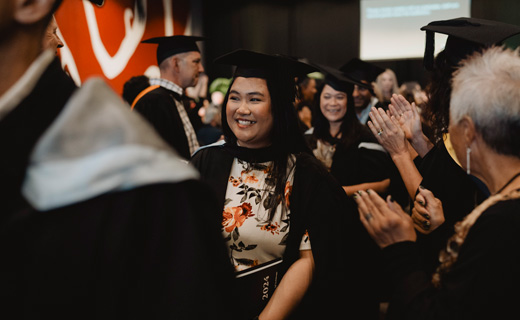 Toi Ohomai Graduand walking through the guard of honour