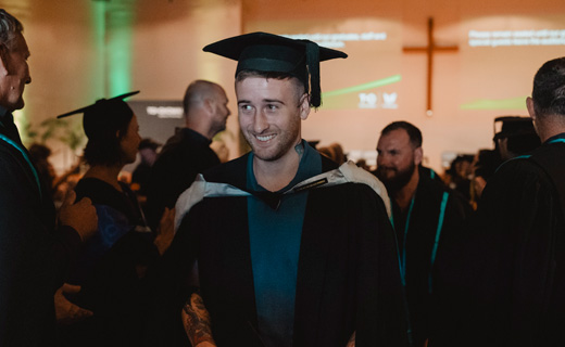 Toi Ohomai graduand walking through the guard of honour