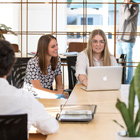 Computing students looking at a laptop Computing students looking at a laptop