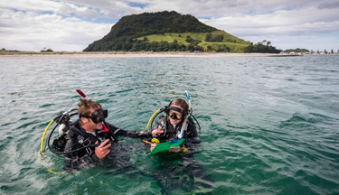 Marine students in the water with their dive gear Marine students in the water with their dive gear