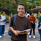 International student standing with his friends International student standing with his friends