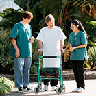 Healthcare Assistants helping a patient Healthcare Assistants helping a patient