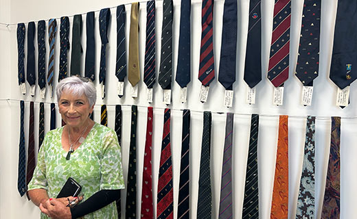 Jan Hausman with her husband's tie collection