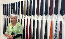 Jan Hausman with her husband's tie collection